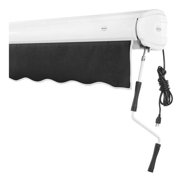 An Awntech Key West retractable patio awning with black fabric and a white protective hood.