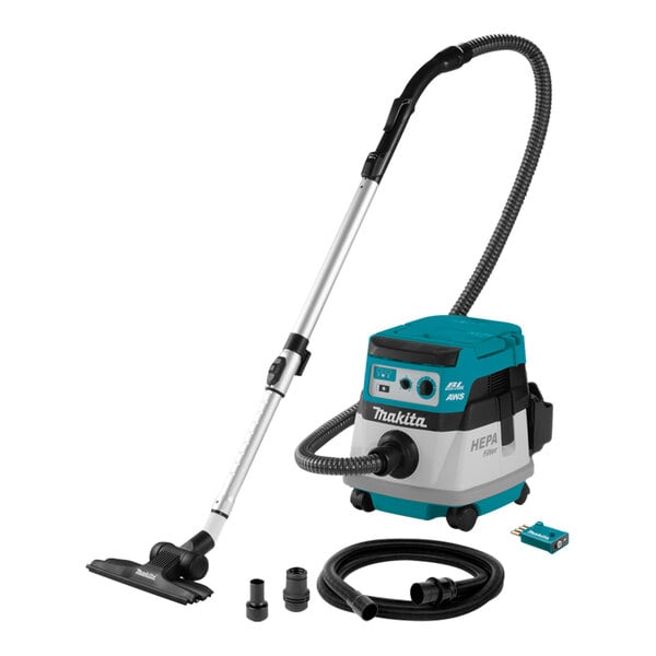 A Makita vacuum cleaner with a tube and accessories.