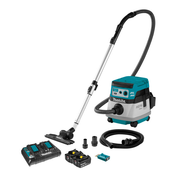 A Makita cordless vacuum cleaner in a room with a tube and other objects.