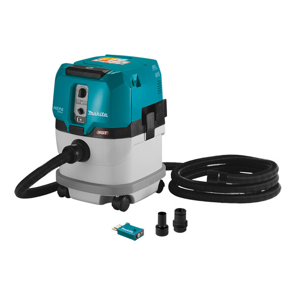 A blue and white Makita cordless vacuum cleaner with black hoses.