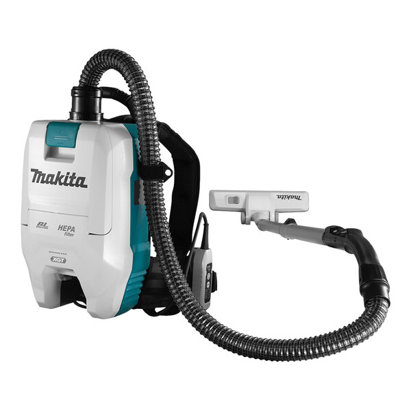 A white Makita backpack vacuum cleaner with a hose.