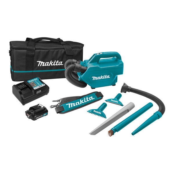 A blue and black Makita 12V MAX CXT vacuum cleaner with a black bag and hose.