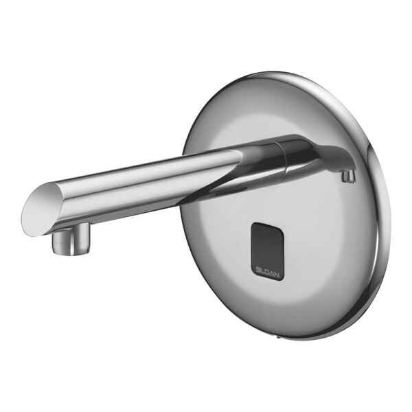 A Sloan chrome wall mount sensor faucet with a round base.