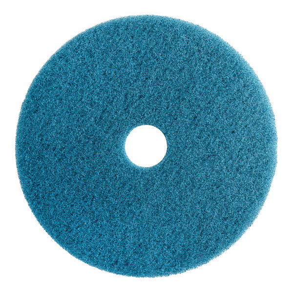 A blue Lavex burnishing pad for a floor machine.