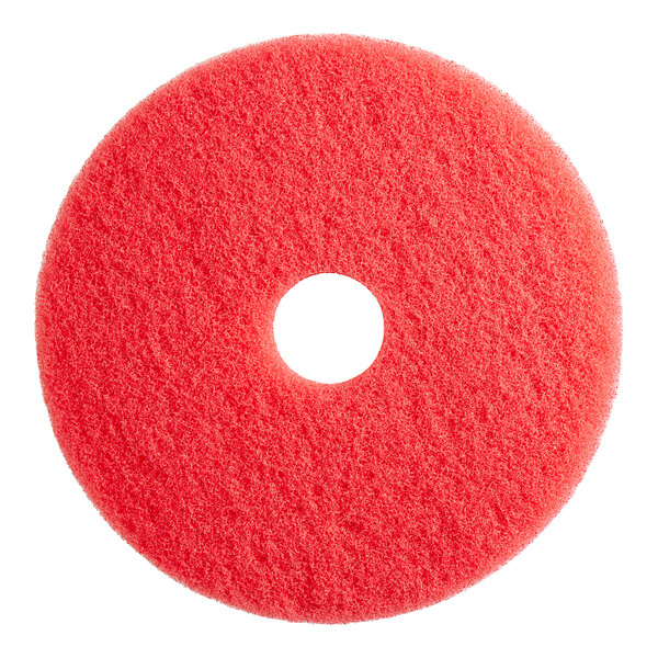 A red circular Lavex floor machine pad with a hole in the middle.