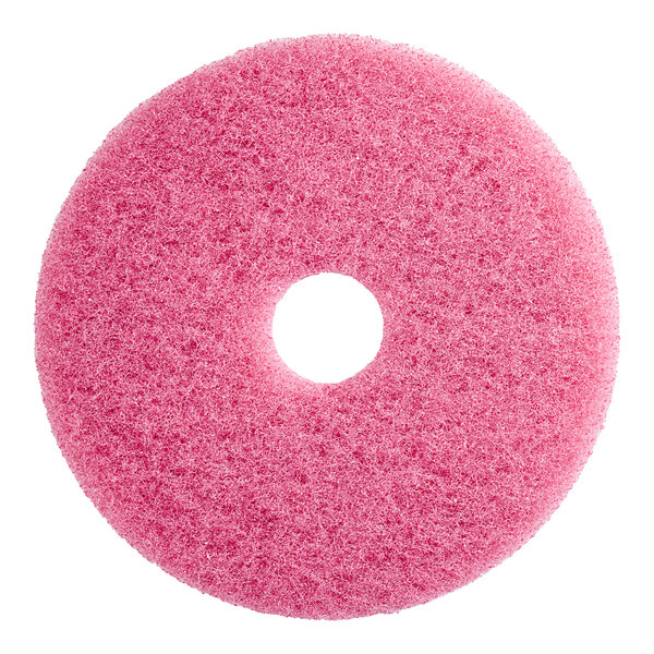 A pink circular Lavex sponge pad with a hole in the middle.