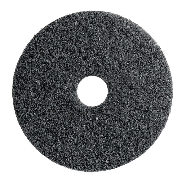 A black circular Lavex Pro stripping pad with a hole in the middle.