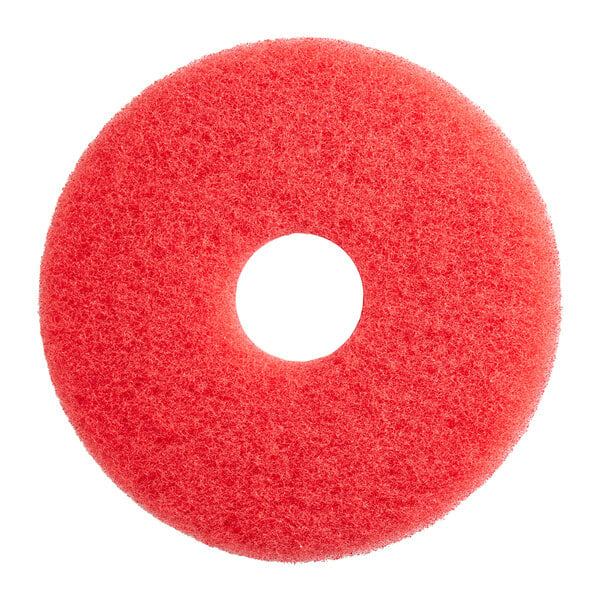 A red sponge pad with a hole in the middle.