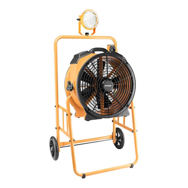 A yellow and black XPOWER industrial fan on wheels with a light.