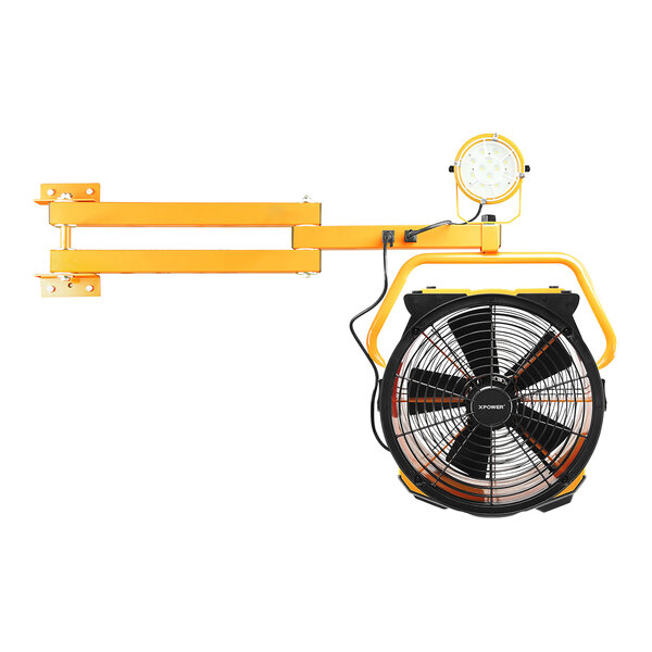An XPOWER yellow and black axial fan with an LED spotlight attached to a yellow pole.