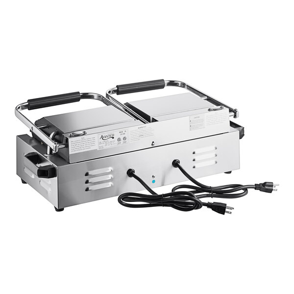 An Avantco commercial dual panini sandwich grill with two handles and wires attached.