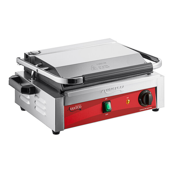 An Avantco commercial panini grill with a red and black handle.