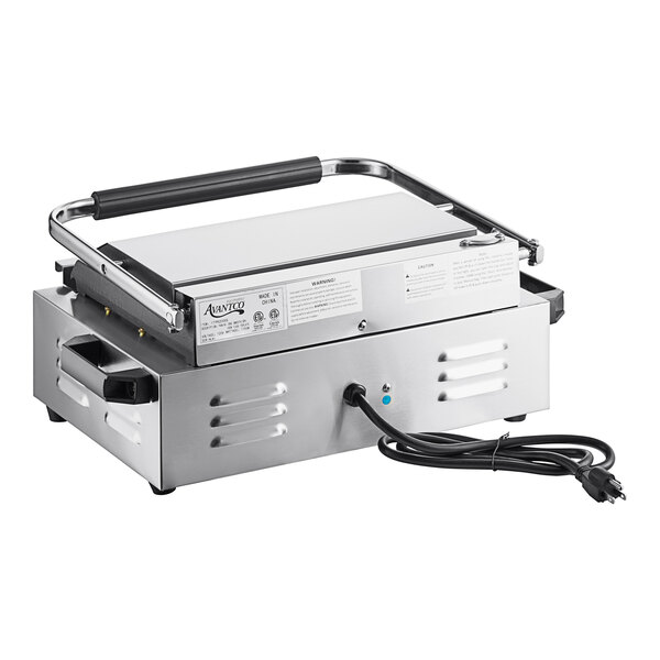 A silver rectangular electric grill with black handles.