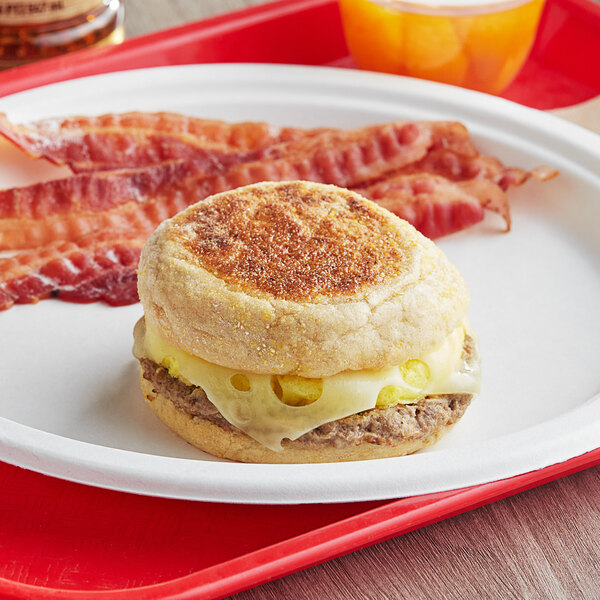 A Grand Prairie turkey sausage, egg, and cheese breakfast sandwich on a plate.