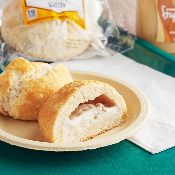 A close up of a Grand Prairie Sausage Gravy Stuffed Buttermilk Biscuit in a bag.