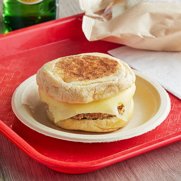 A Grand Prairie turkey sausage, egg, and cheese muffin sandwich on a plate.