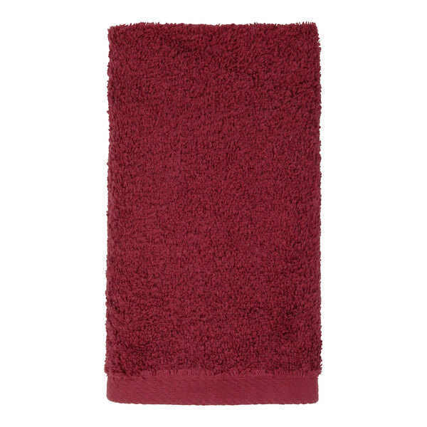 A red 1888 Mills hand towel on a white background.