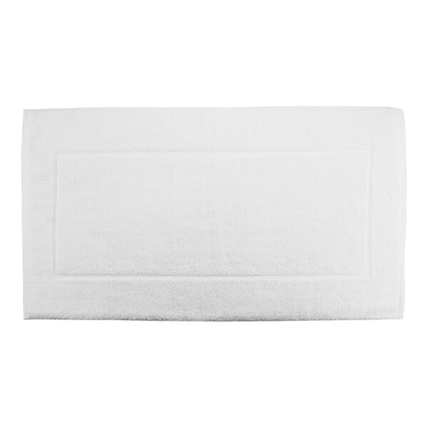A white rectangular bath mat with a rectangle border.