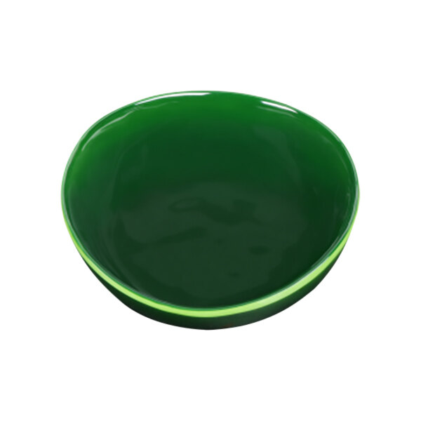 A green irregular round melamine bowl with a white background.