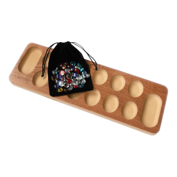 A Yard Games Table Top Mancala game board with a bag of colorful stones.