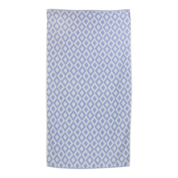 A blue and white Fibertone pool towel with a diamond pattern.