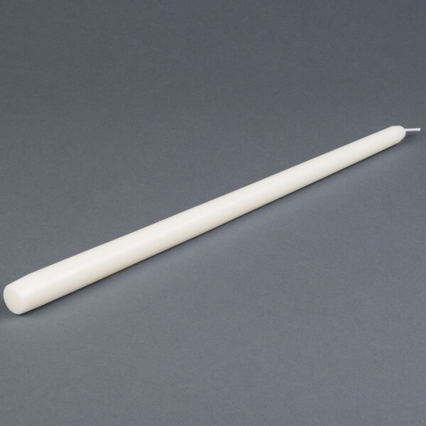 A 15 inch ivory Will & Baumer taper candle.