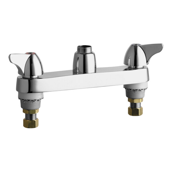 A close-up of a chrome Chicago Faucets deck-mounted faucet base with two wing handles.