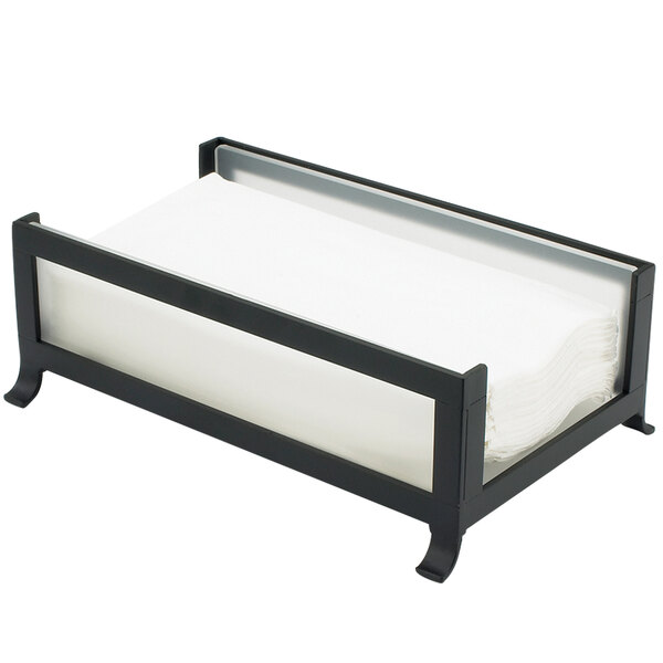 A black Cal-Mil Soho napkin holder with frosted glass sides holding white napkins.