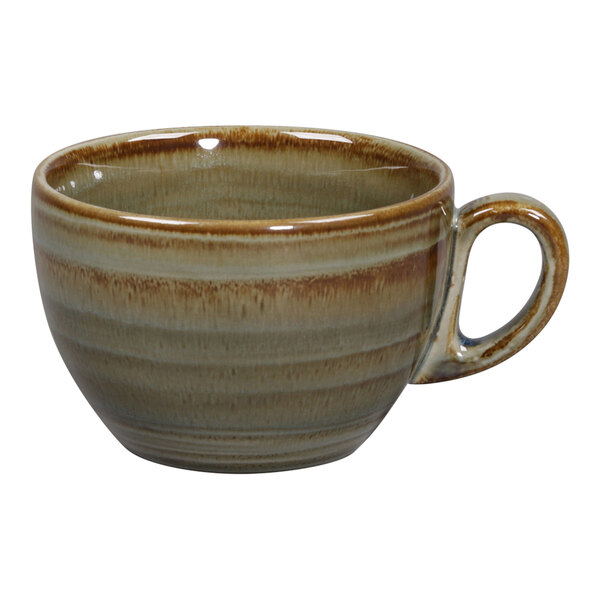 A close-up of a brown and white RAK Porcelain coffee cup with a handle.