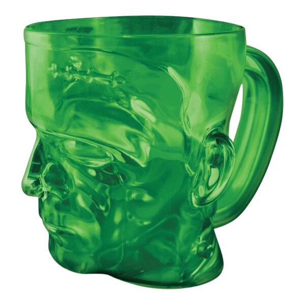 A green plastic mug shaped like Frankenstein's head with a handle.