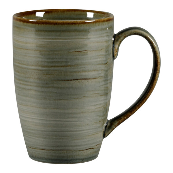 A white porcelain mug with a peridot green interior and brown handle.