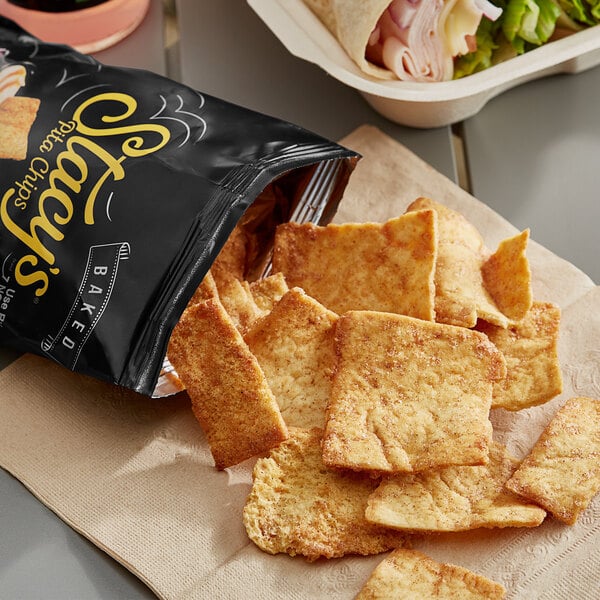 A bag of Stacy's Cinnamon Sugar Pita Chips next to a sandwich.
