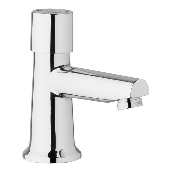 A Chicago Faucets deck-mounted metering faucet with chrome finish and a single handle.