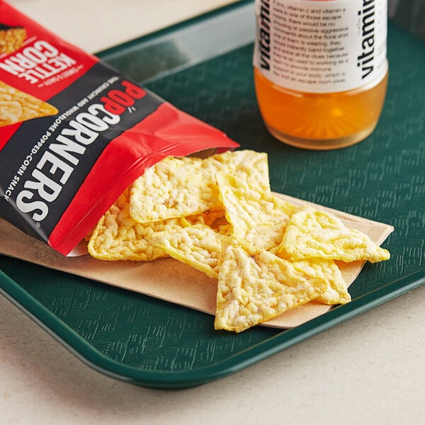 A tray with bags of Popcorners Kettle Corn chips.