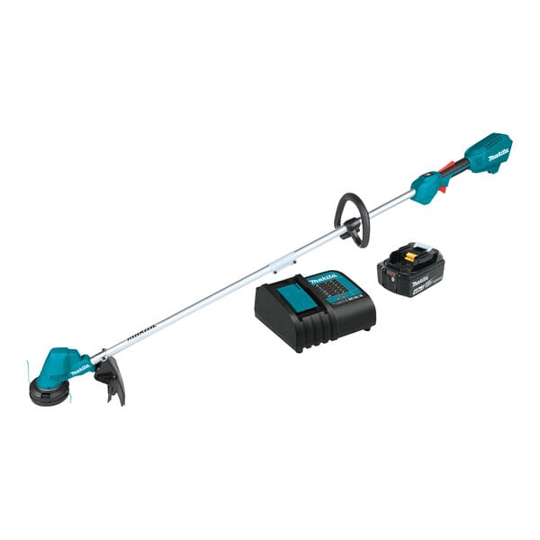 A close-up of a Makita cordless string trimmer with a black and blue battery.