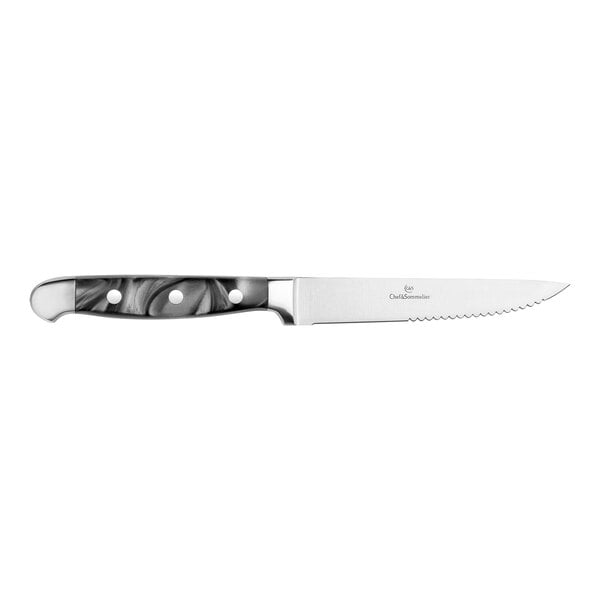 A Chef & Sommelier stainless steel steak knife with a black and white marble pattern on the handle.