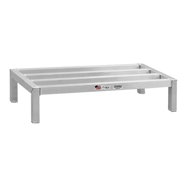 A white metal New Age aluminum dunnage rack with legs.