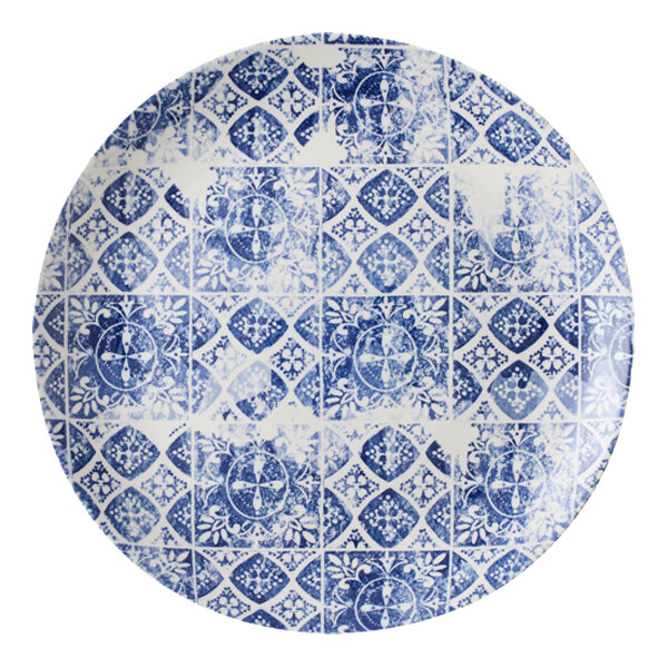 A Dudson Maker's Porto blue and white china plate with a circular pattern.