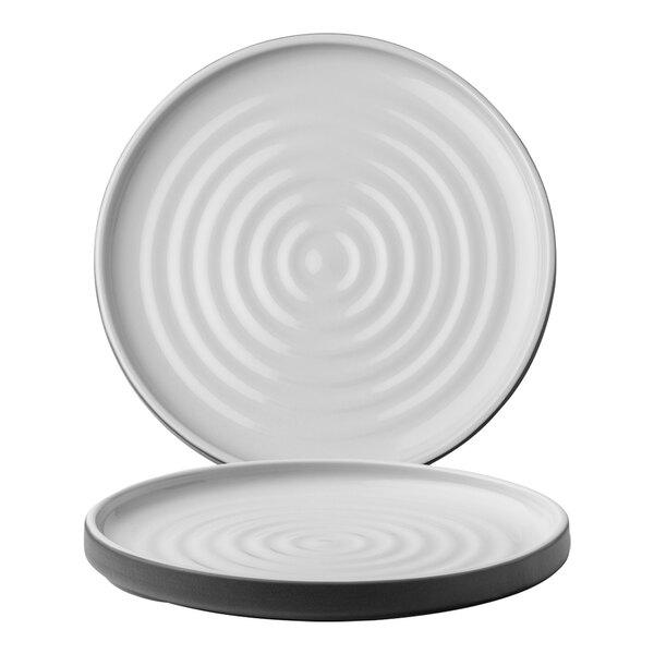 A white Chef & Sommelier stoneware plate with a spiral pattern.