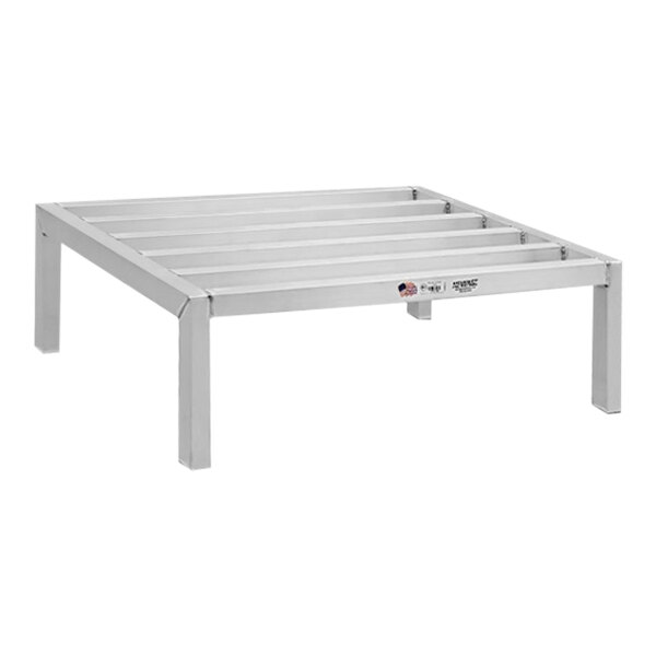A New Age aluminum dunnage rack with metal legs.