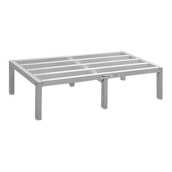 A New Age aluminum dunnage rack with four legs.