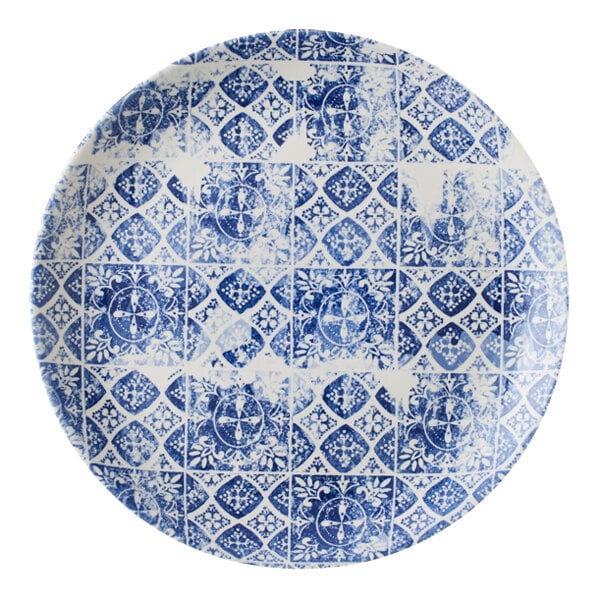A white Dudson Maker's Porto china coupe plate with a blue circular pattern.