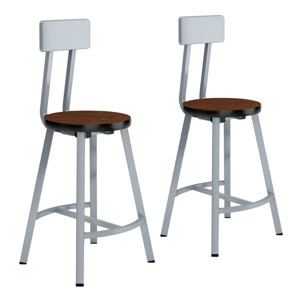 A pair of National Public Seating Titan lab stools with Montana Walnut wooden seats.