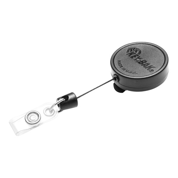 A black KEY-BAK badge holder with a clip and black retractable cord.