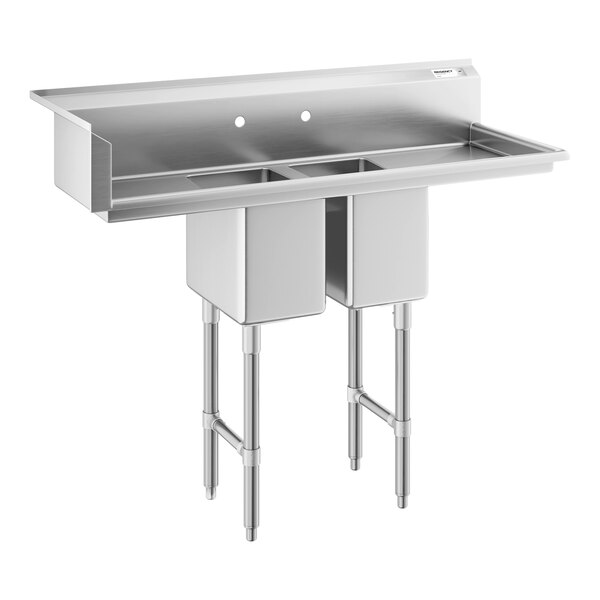 A stainless steel double-basin sink with four metal legs and a backsplash featuring two faucet holes.