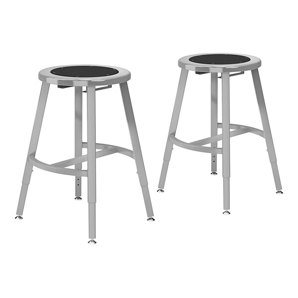 Two National Public Seating steel lab stools with black seats and backs.