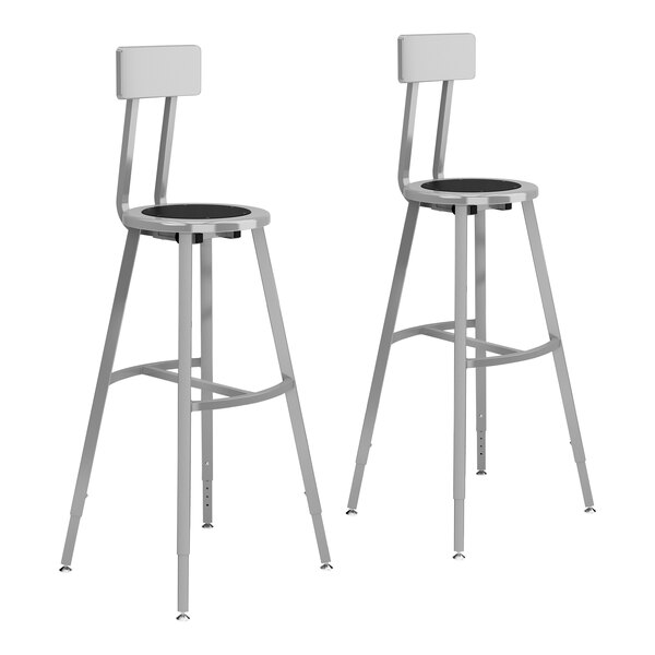 A pair of gray steel National Public Seating lab stools with black seats and backrests.