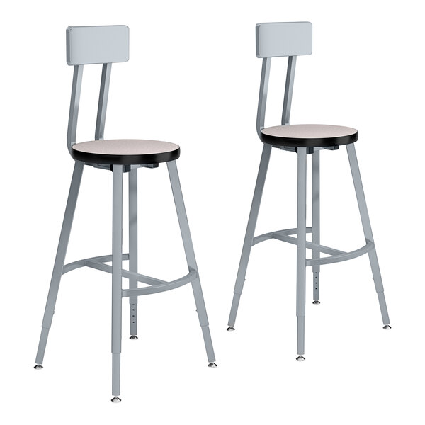 Two National Public Seating lab stools with gray seats and backs and metal frames.