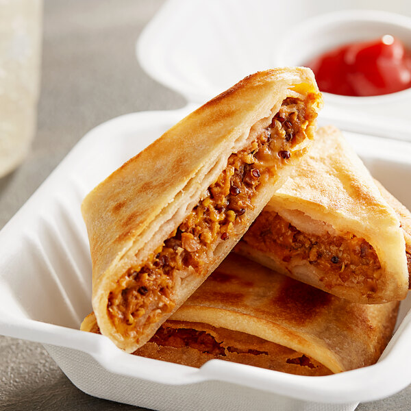 A stack of MingsBings Plant-Based Vegan Cheeseburger Bing Pockets in a white styrofoam container.