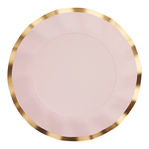 A close-up of a Sophistiplate blush pink wavy paper dinner plate with a gold rim.